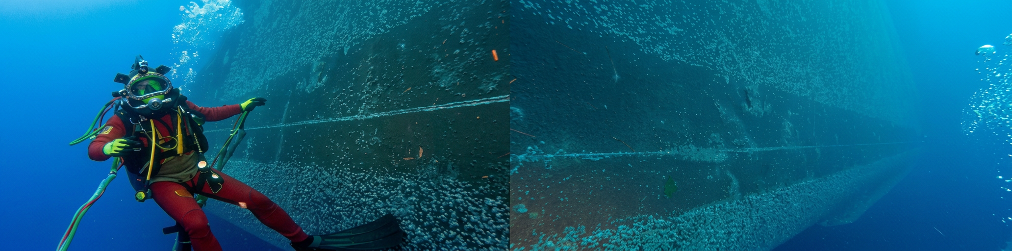 Diver operating Vacu-Cart system underwater on a ship hull